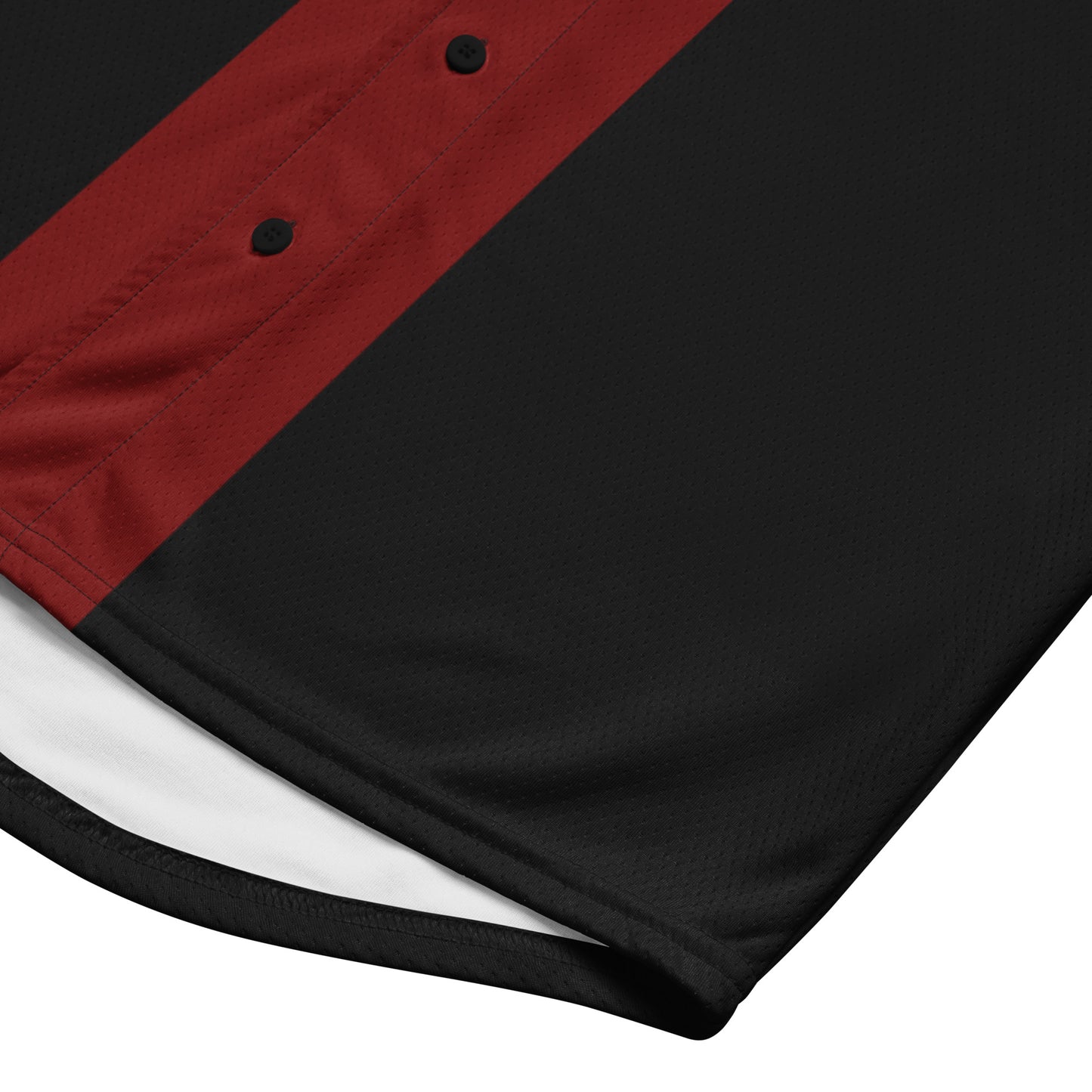 Black & red mesh jersey with a diagonal red button placket. White lining visible at the curved hem.