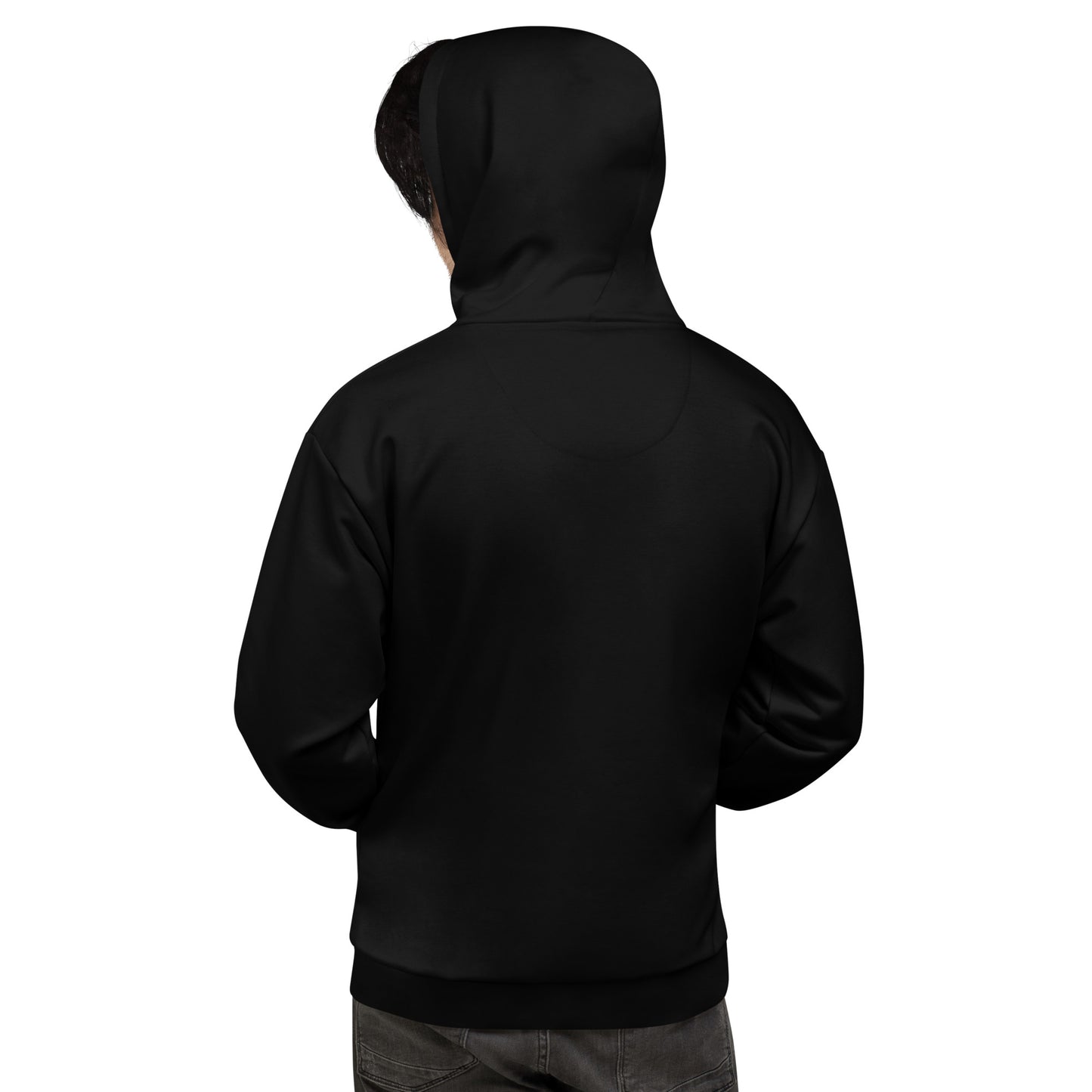 A person viewed from the back, wearing a black hooded sweatshirt with the hood up and dark pants against a white background.