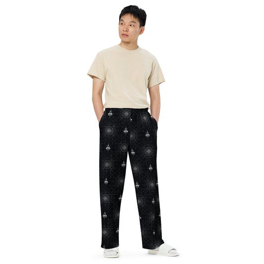 Black pajama pants with white repeating Assassin's Creed logo & radiating geometric designs.