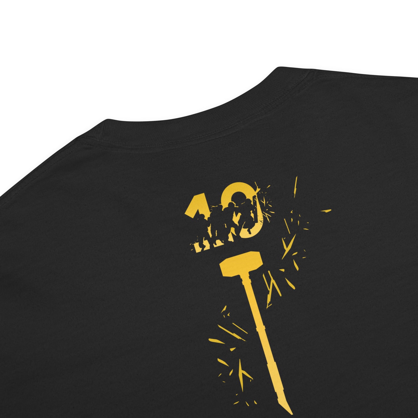 Black tee, yellow graphic: '10' with figures appearing to break out of the '0', a hammer, and radiating fragments.