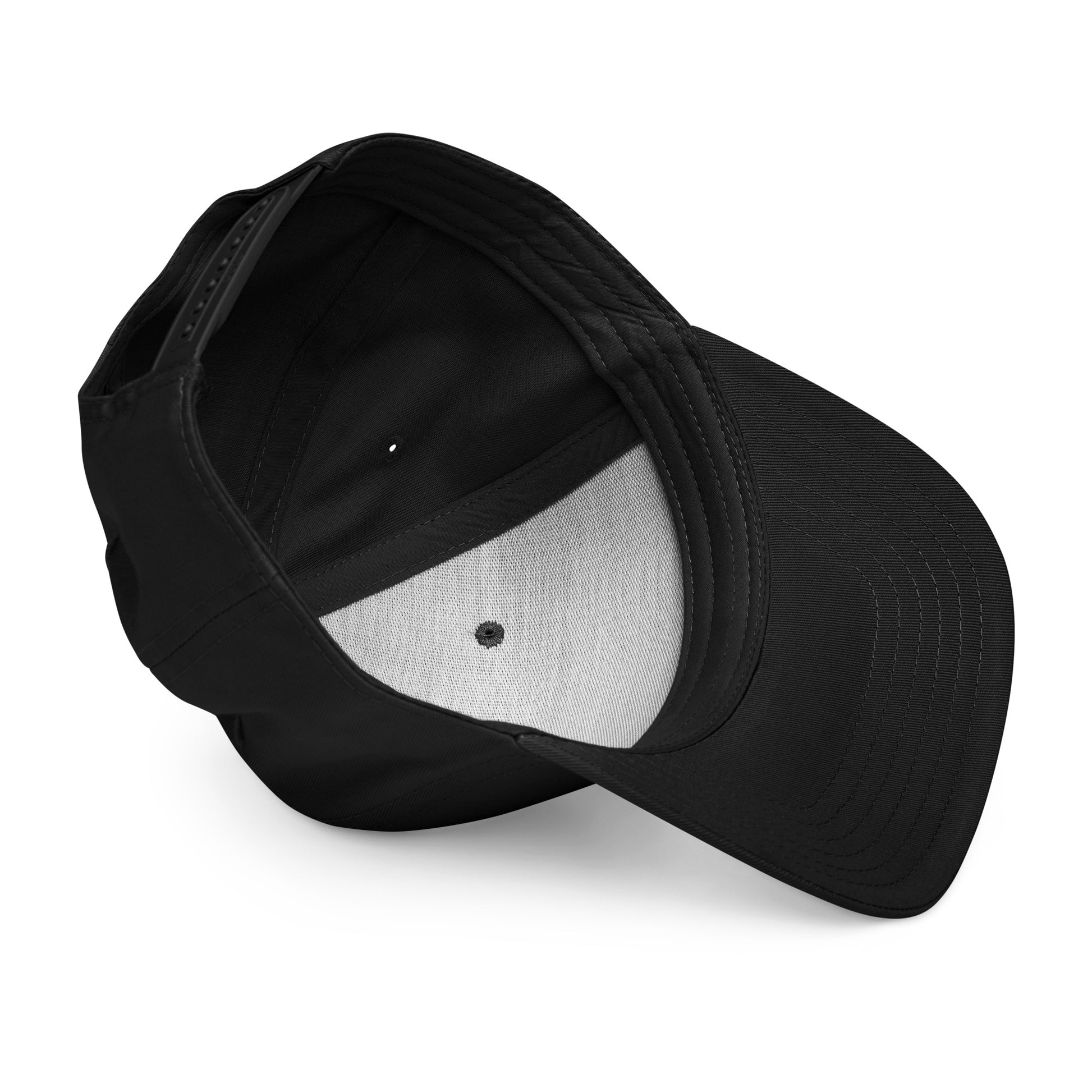 Inside view of a black baseball cap, angled to show the brim, internal mesh lining, and adjustable strap, on a white backgrou
