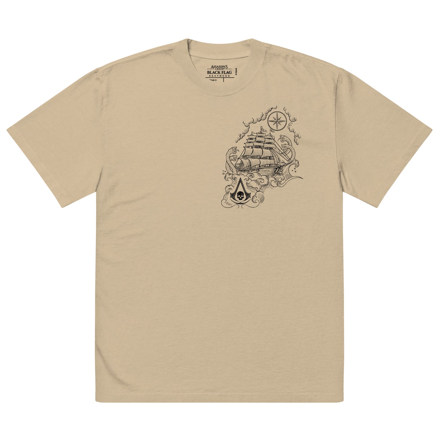 Tan t-shirt with visible fabric texture, neat collar and sleeve stitching, and a printed 'Assassin's Creed Black Flag' neck l