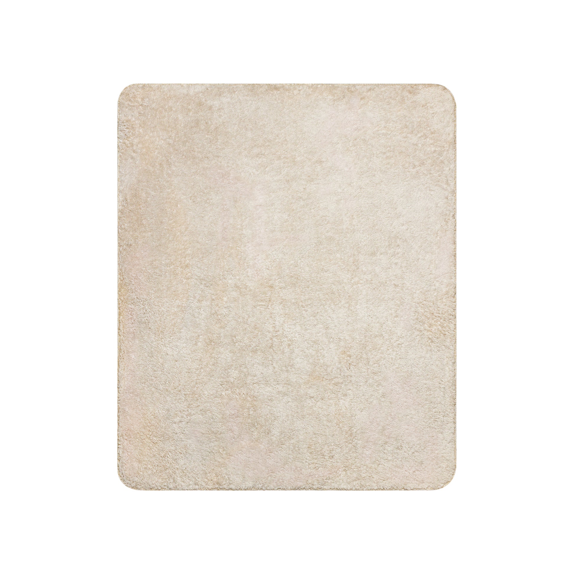 Light beige shaggy rug, rectangular with rounded corners.